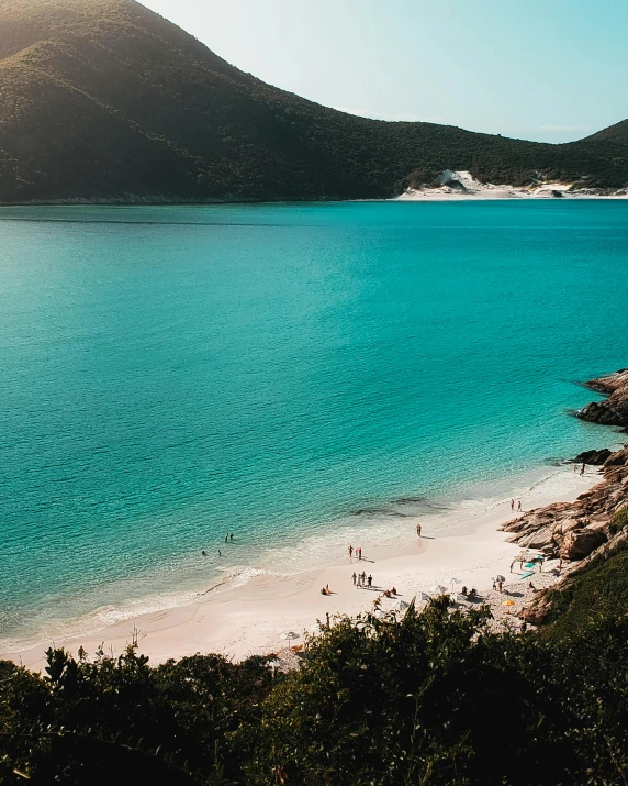 people are enjoying a day on the beach