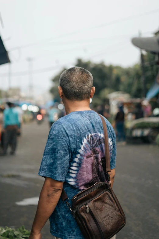 a man is carrying soing on his shoulder