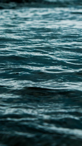a blurry view of water with ripples on it