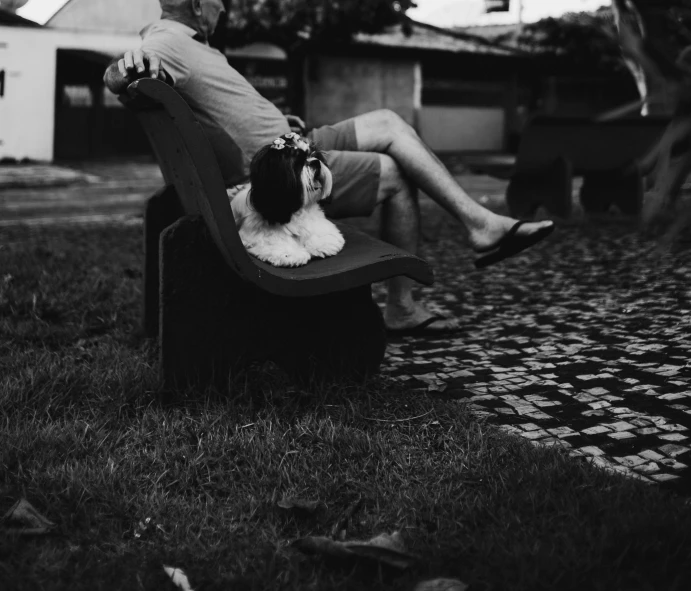 black and white image of a man and his dog