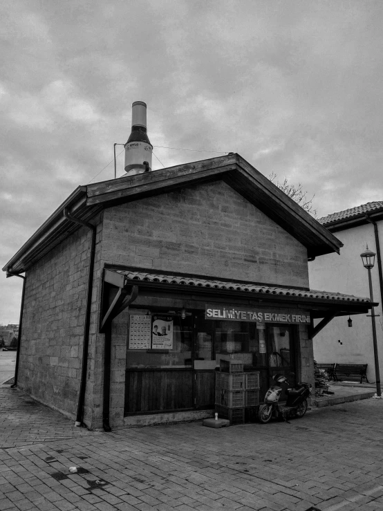 the front of an old fashioned building on a cobblestone road