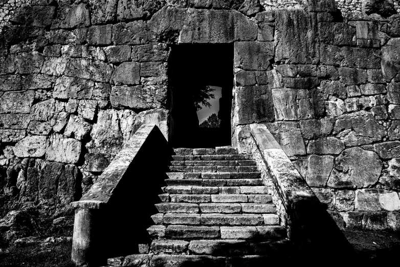 a man stands alone on an open staircase