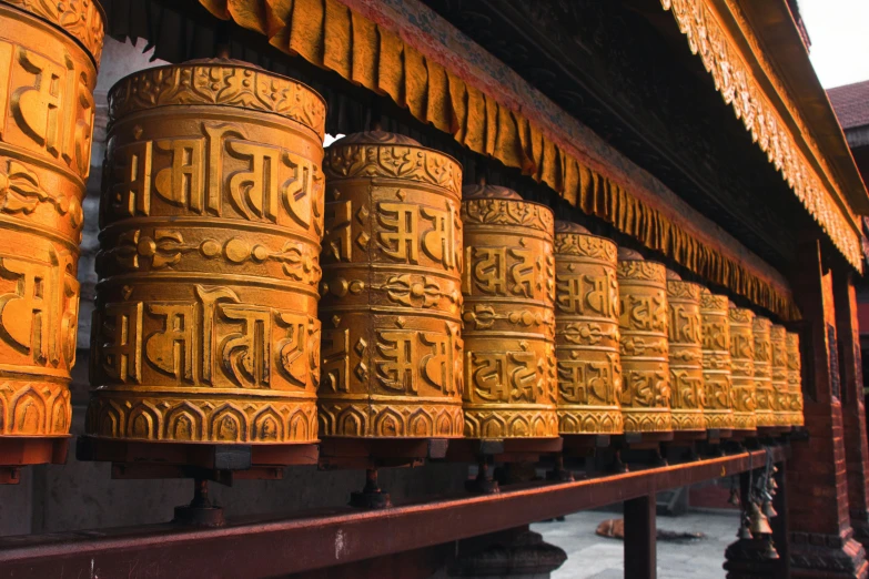 bells that have arabic writing on them in a row