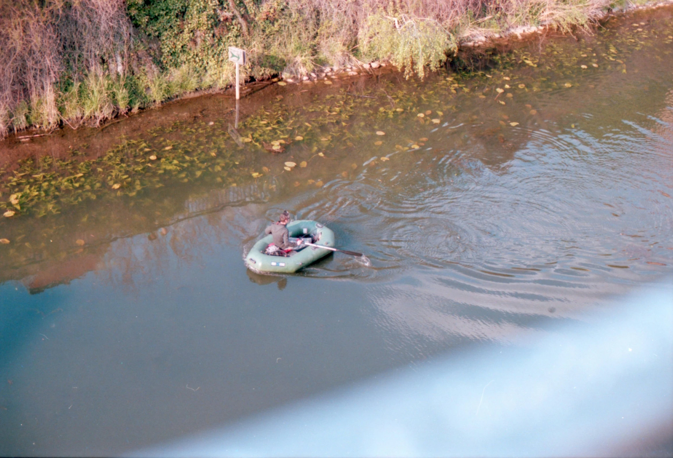 an object is in the water on a paddle