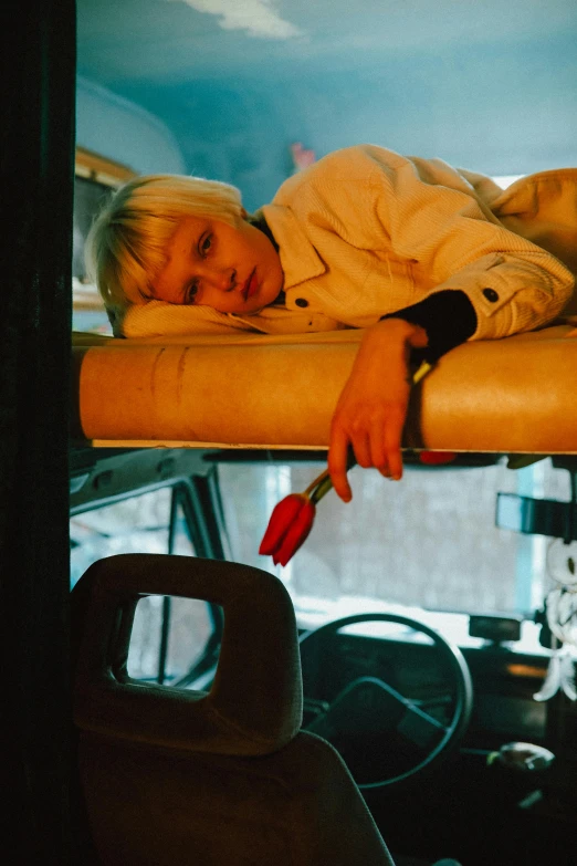 a woman lies on top of an office chair