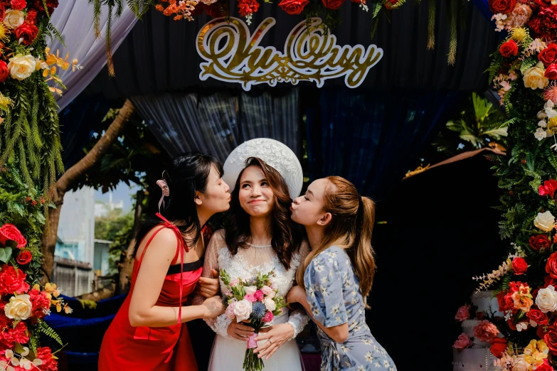 two women are hugging and posing for a po