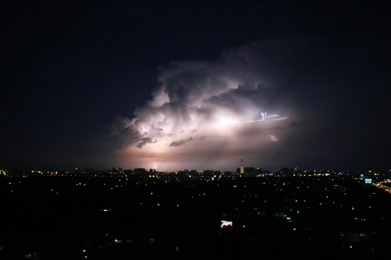 a brightening sky at night over a city