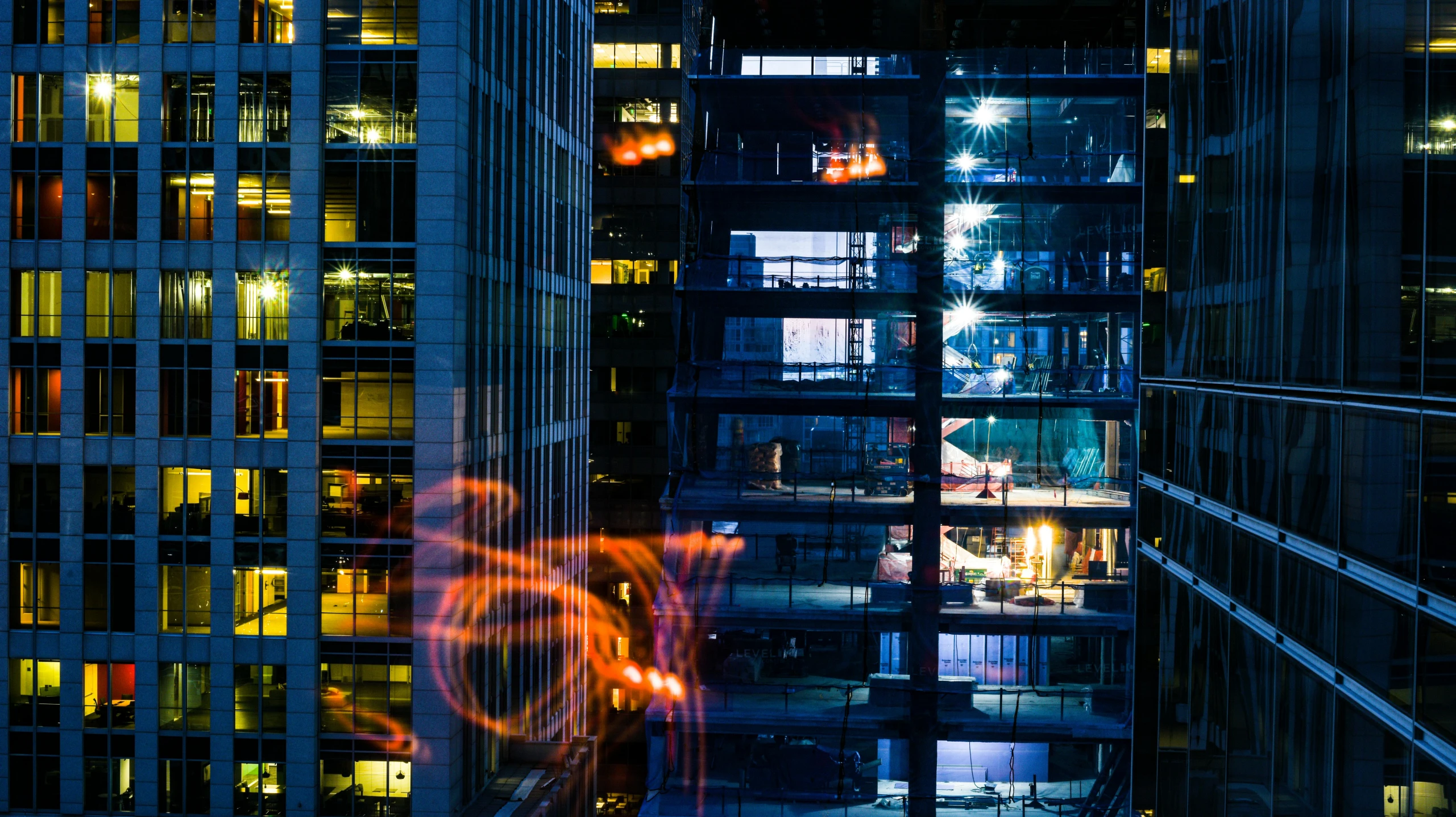 a city at night with illuminated buildings and large circles