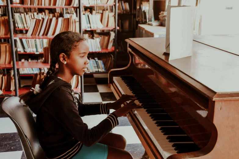 a  is playing the piano inside a liry