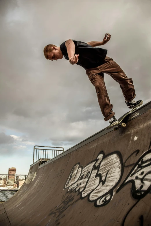 a man is riding down the side of a ramp on a skateboard