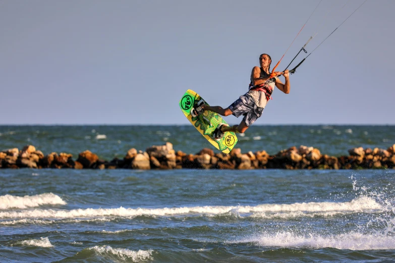 a person on a surf board being pulled into the air