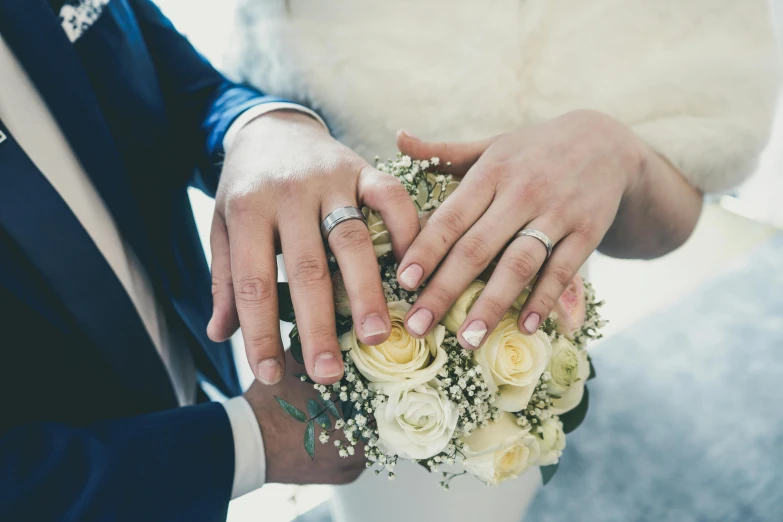 a man and woman holding each other's hands