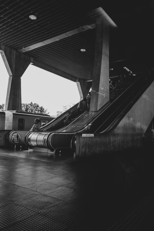 a black and white po of the inside of a subway station