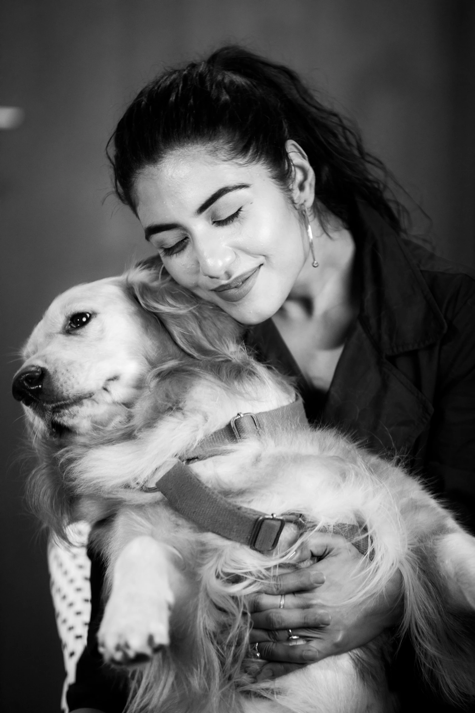 a woman with a hair bun and some dogs