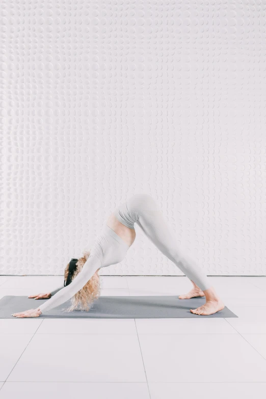 a woman in the splits with her legs crossed