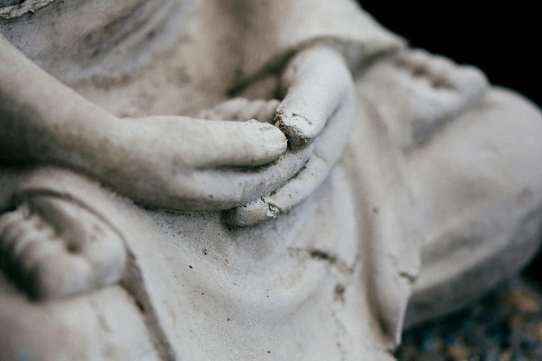 a statue has a ring on it's wrist