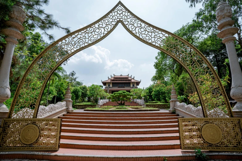 the entrance to the pagoda is surrounded by beautiful landscaping