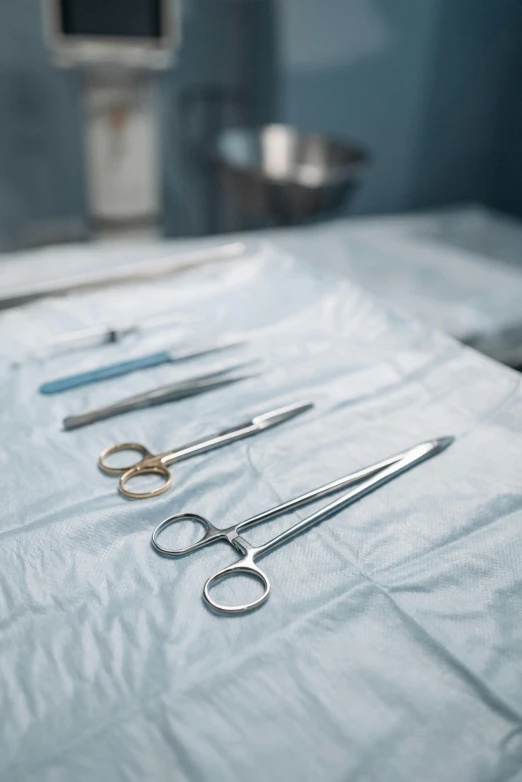 a close up of various scissors on a table