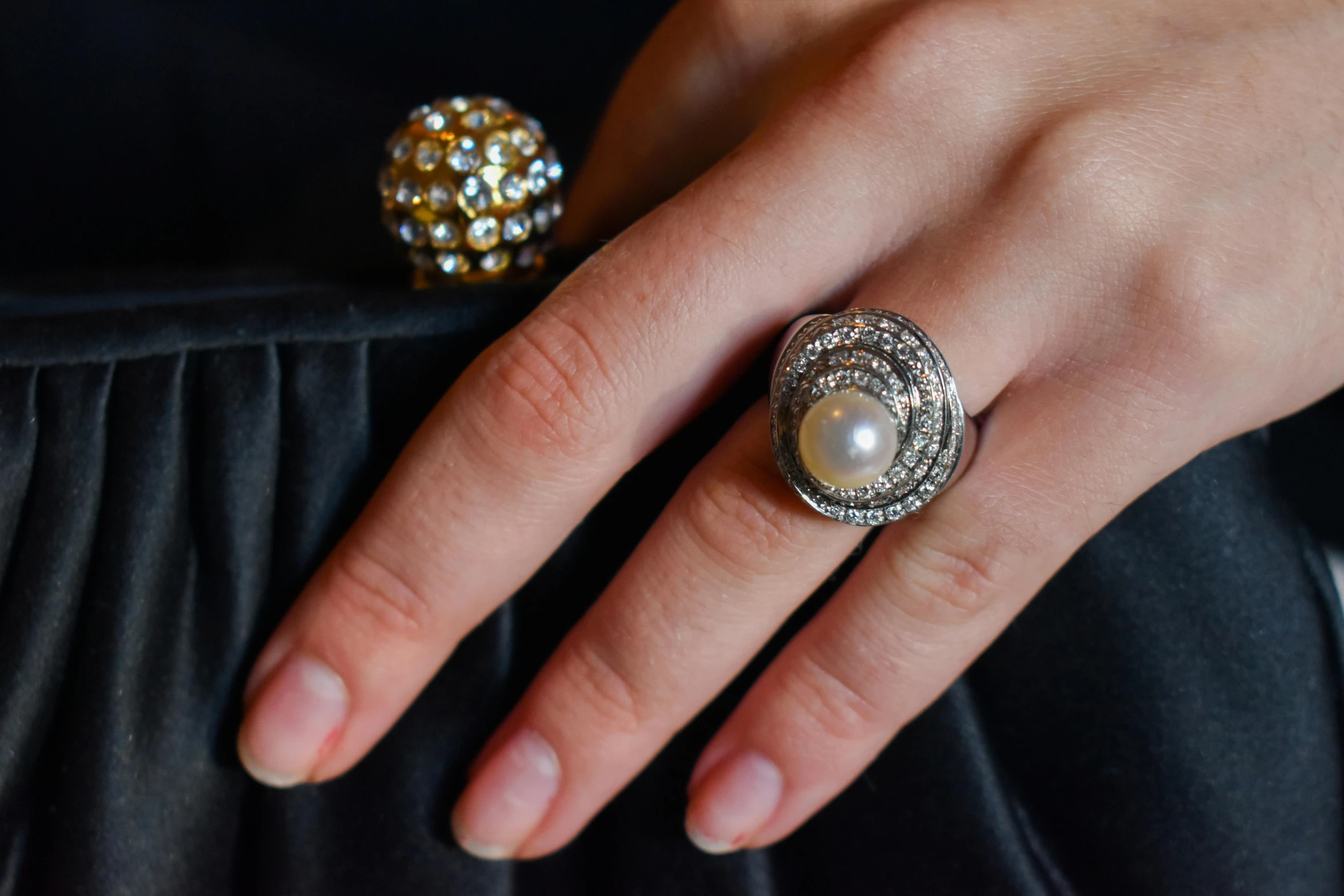 a ring with a pearl in it