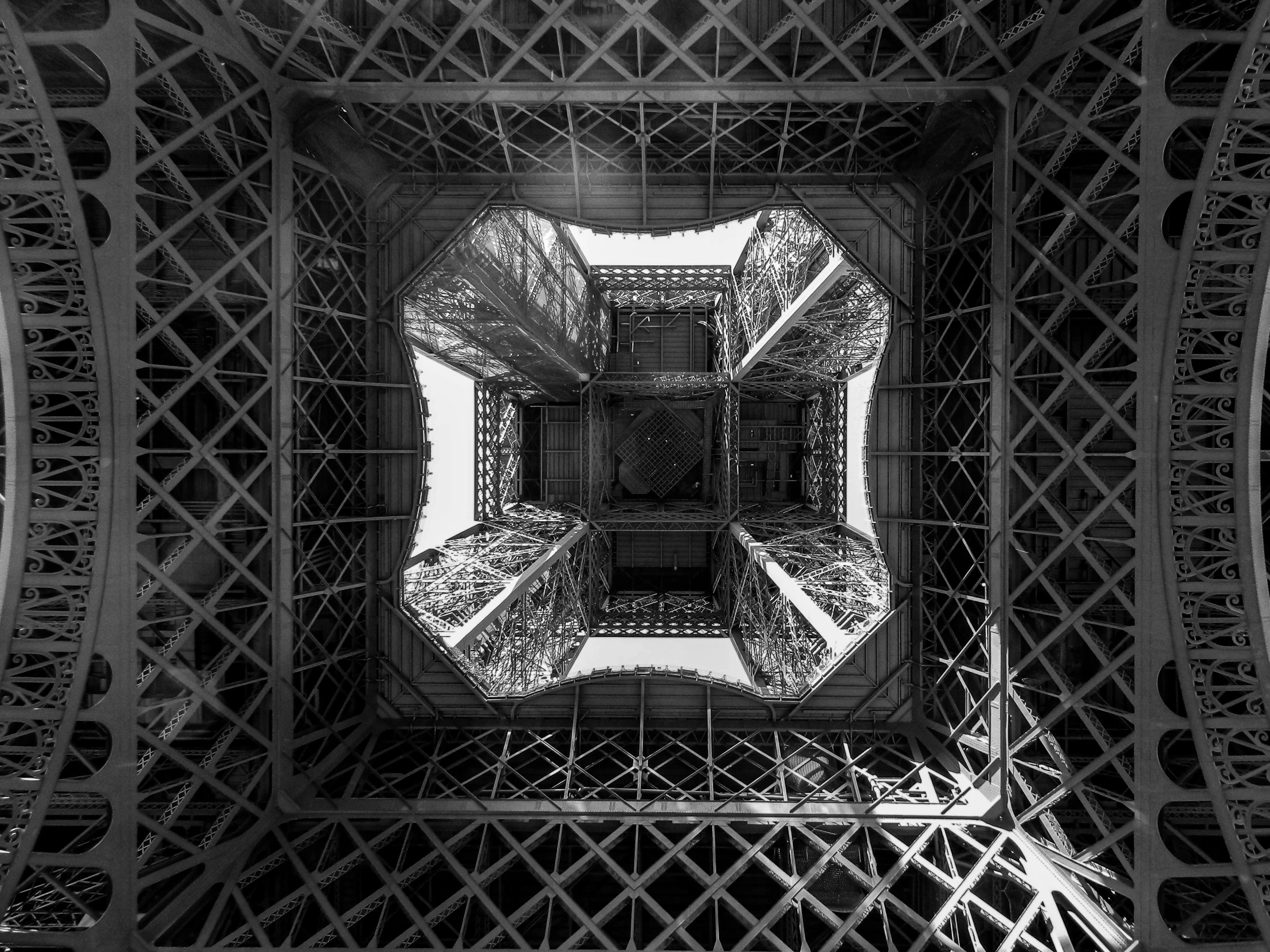 the inside of a metal structure in black and white