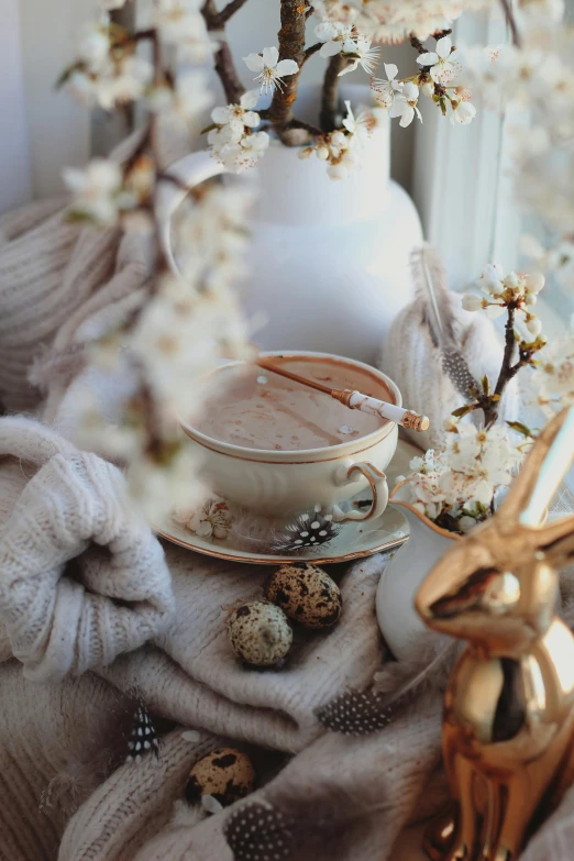 a cup and saucer sitting on a table