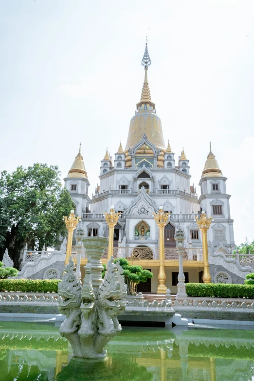 the fountain in front of the building is decorated like a bird's nest