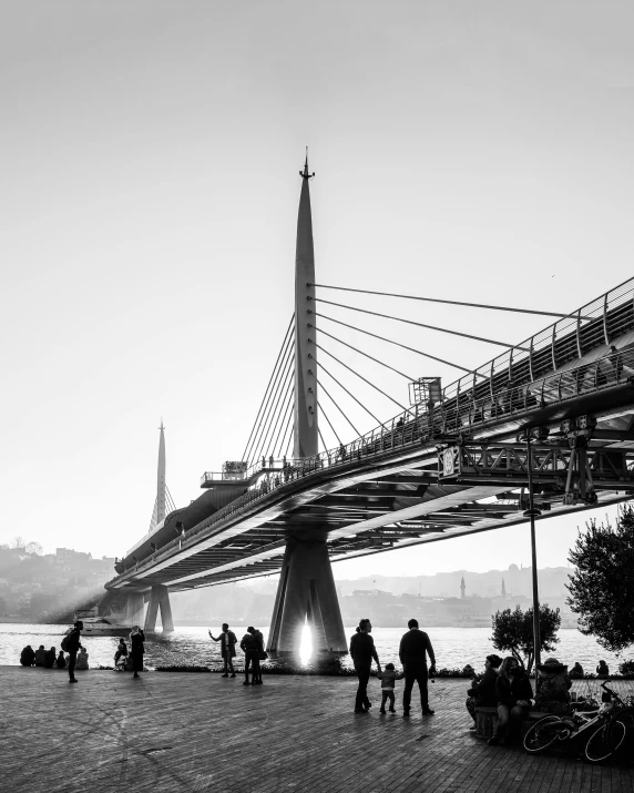 a large bridge spans over a small body of water