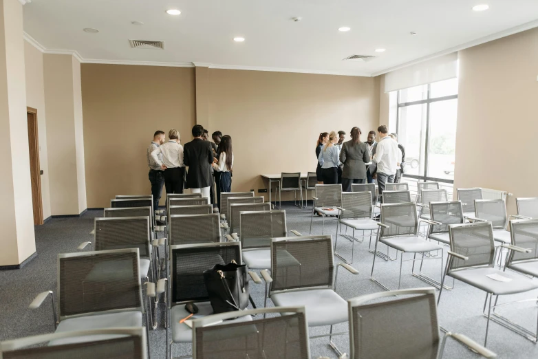 people are standing in an empty waiting area