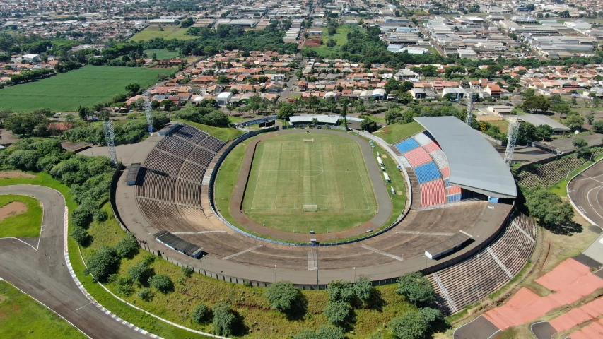 an aerial s of the soccer field in the middle of town