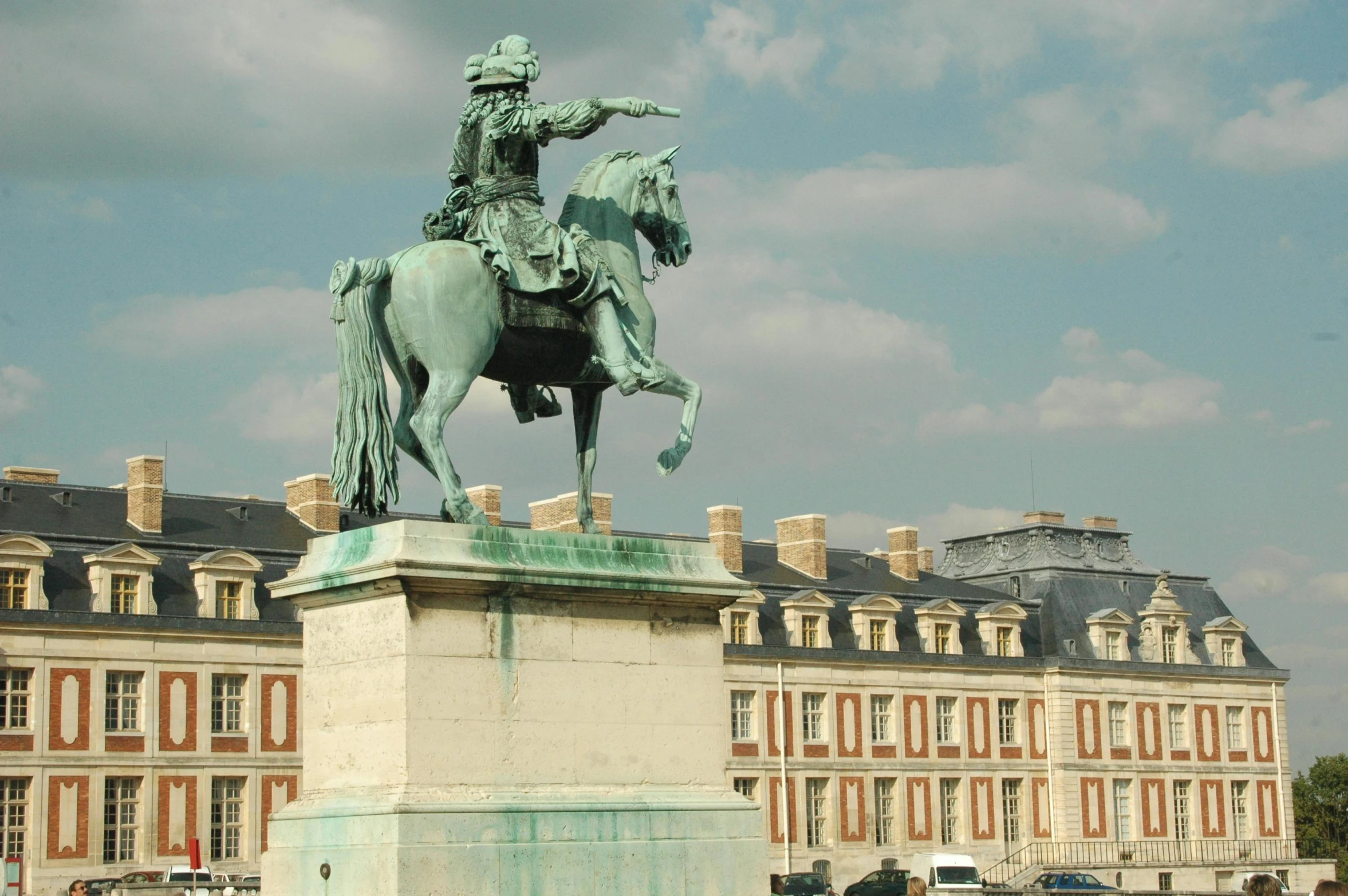 a man on a horse next to buildings