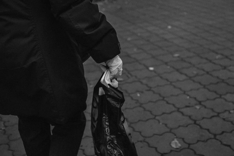 black and white pograph of a person walking down the street