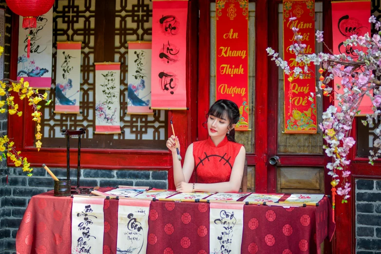 a woman stands in front of an asian restaurant with many chinese decorations