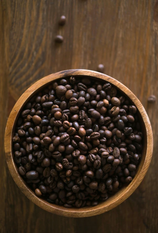 coffee beans in a bowl on a table