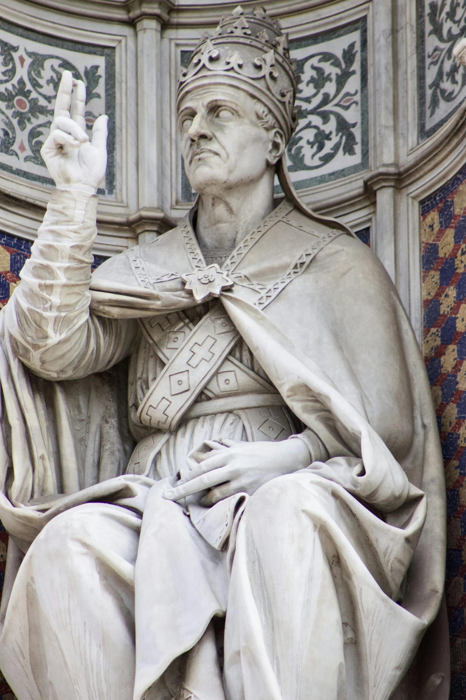 a statue of a pope sitting in a chair