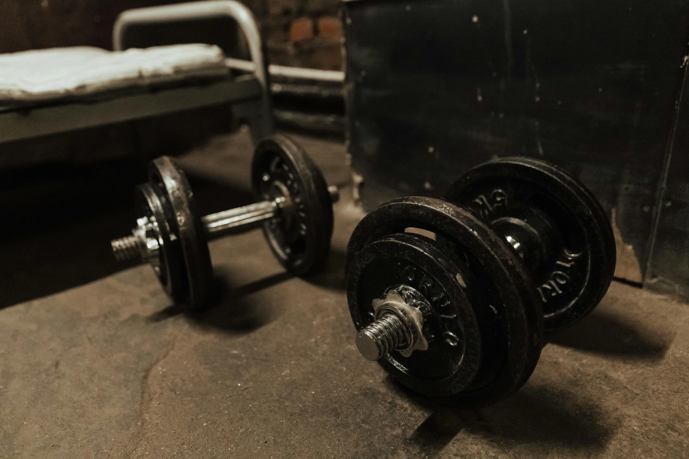 an old gym with weights near bed
