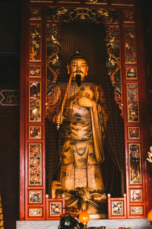 there is a large statue of a person in an oriental area