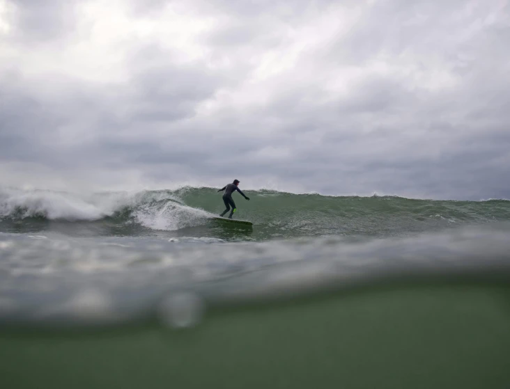 a surfer is in the middle of the water