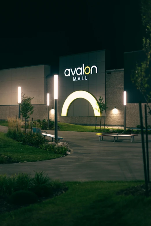 the entrance to the new mall that is lit up at night