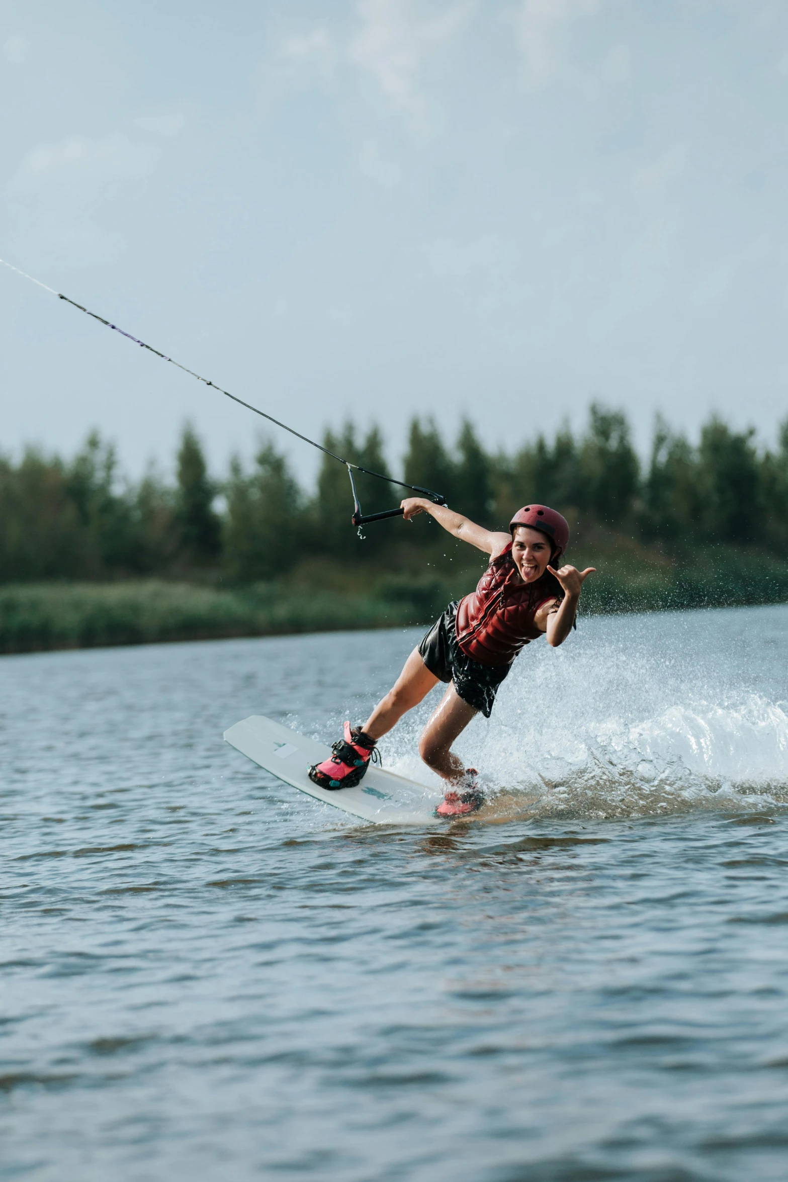 a man paragliding over a body of water