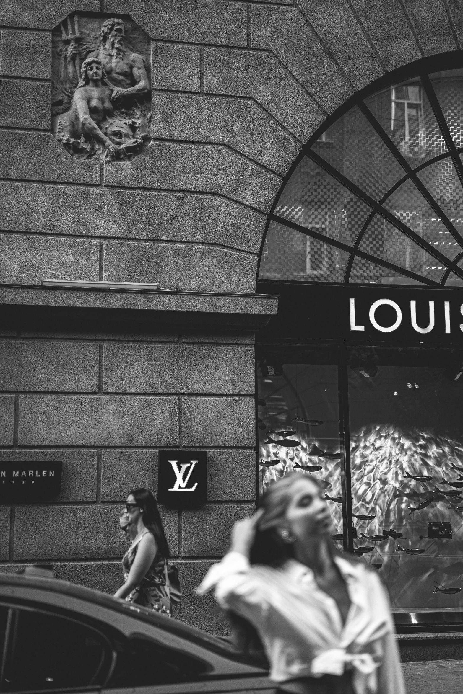 the store fronts the louis vu shop with its signage