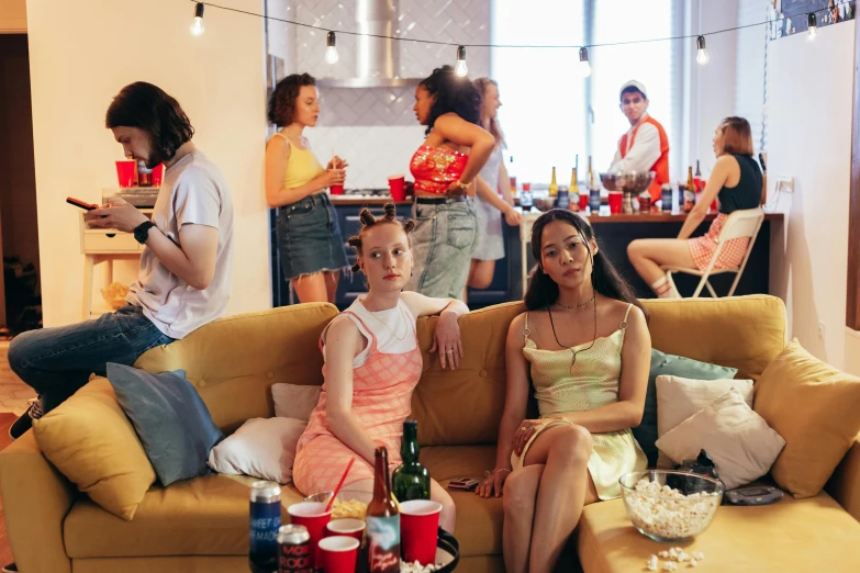 a group of women who are sitting on a couch