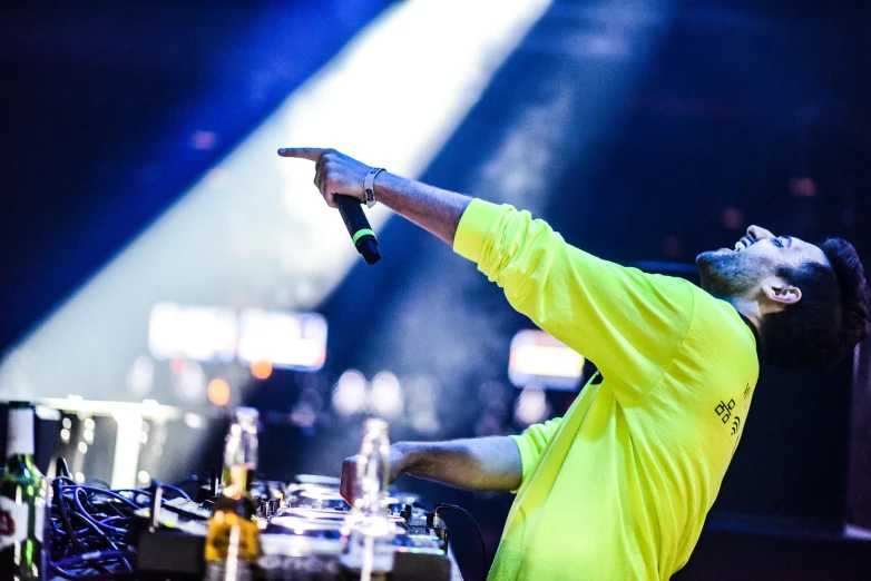 a dj plays on the stage during a concert