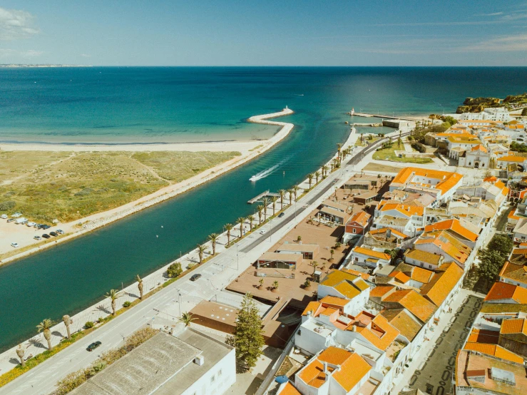 an aerial s of several houses next to the water