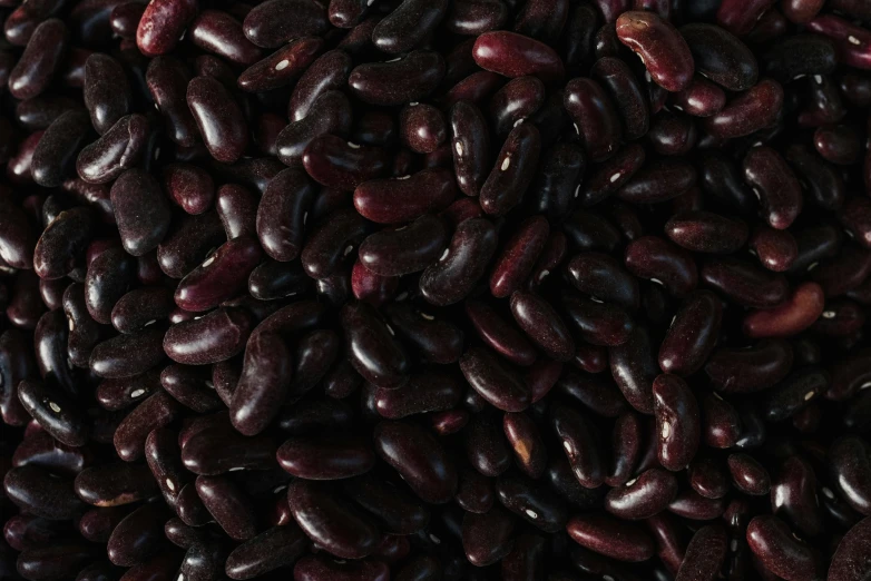 a big pile of red beans on a table