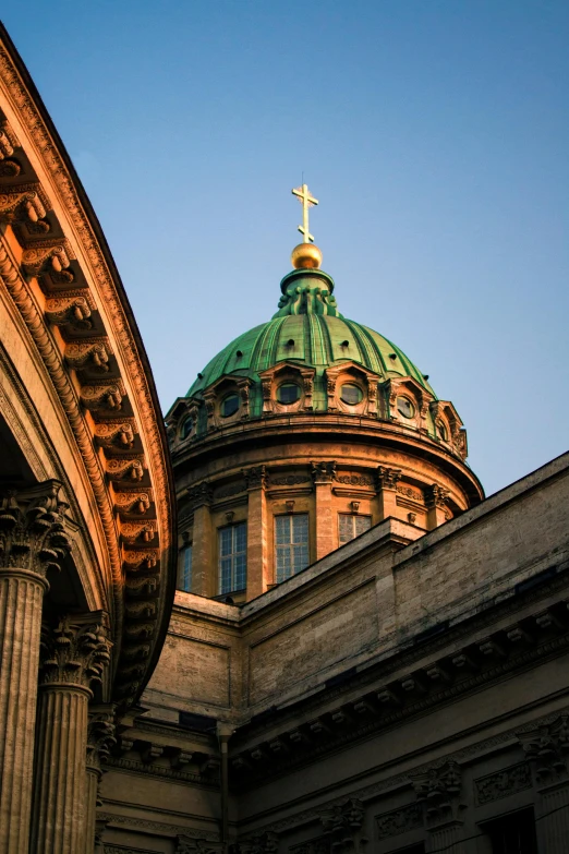 a large round building with a cross on top