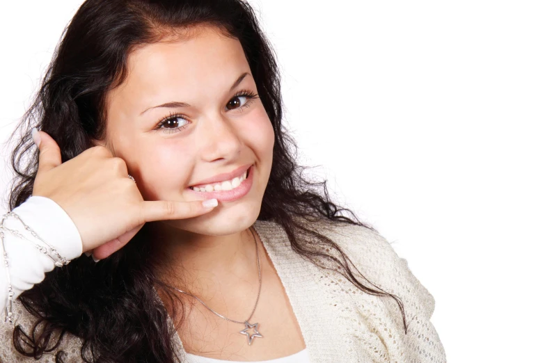 a woman is posing for a po with a necklace