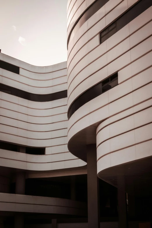 two circular building made out of white stucco