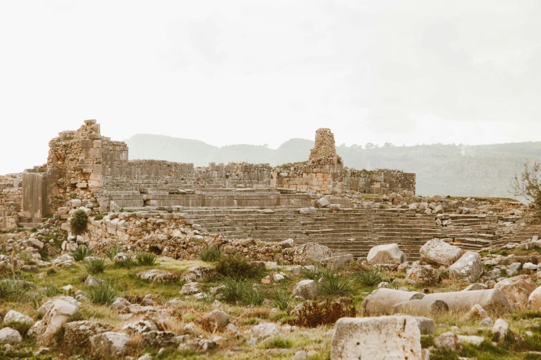 a rock covered outdoor area that resembles an ancient city