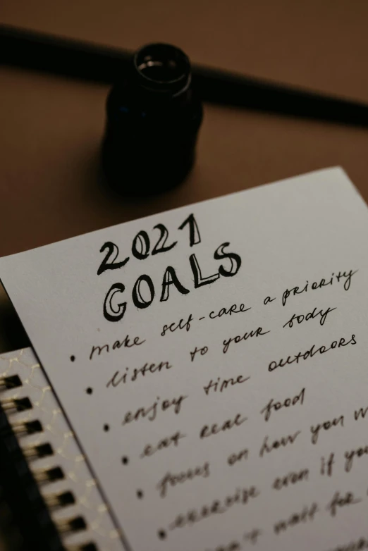 a note with goals written on it