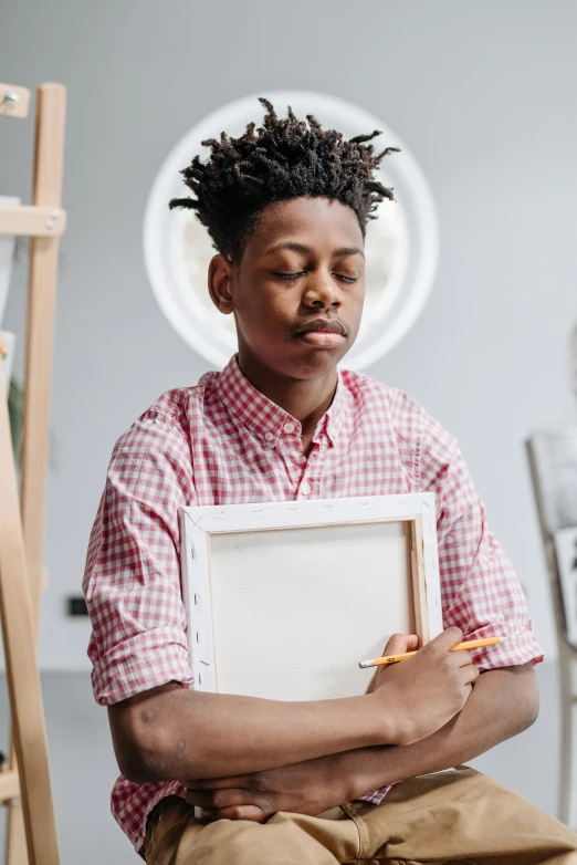 an african american man is holding a piece of furniture